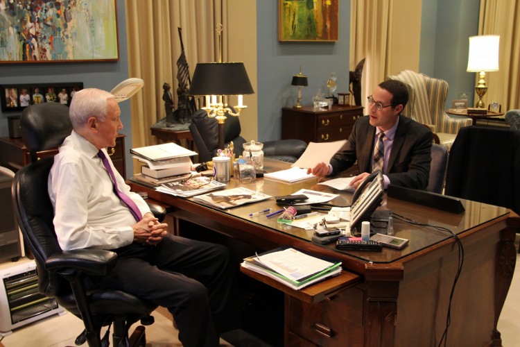 Stuart Portman (BA, '13), right, discusses healthcare policy with Utah Sen. Orrin Hatch in his Washington, D.C. office.