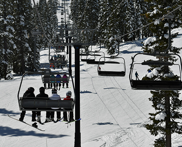 Skiers on a chairlift