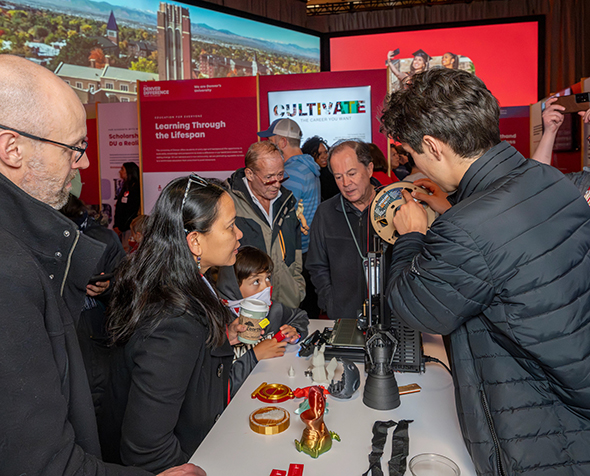 Attendees view an interactive exhibit during the Denver Difference public campaign launch.