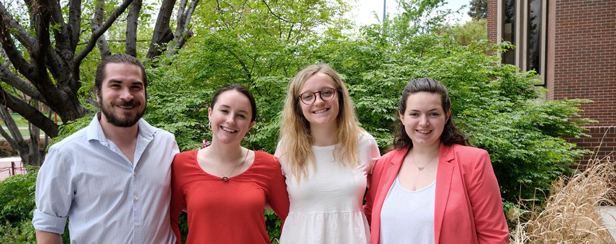 four young alumni