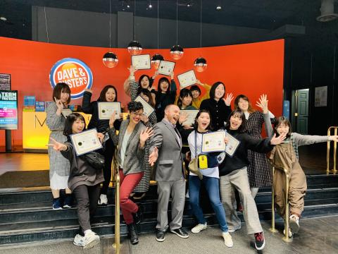 Japanese students with diplomas