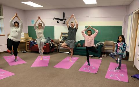 Students practicing yoga